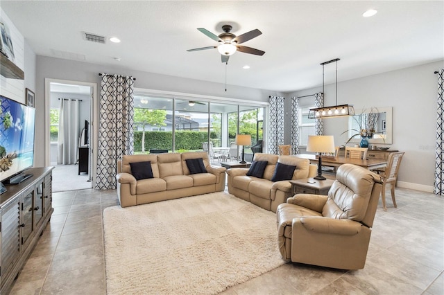 5025 Sunfalls Ave, Saint Cloud, FL 34772 - living area with a ceiling fan, recessed lighting, and baseboards