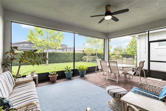 5025 Sunfalls Ave, Saint Cloud, FL 34772 - sunroom / solarium with outdoor dining area, a ceiling fan, and plenty of natural light