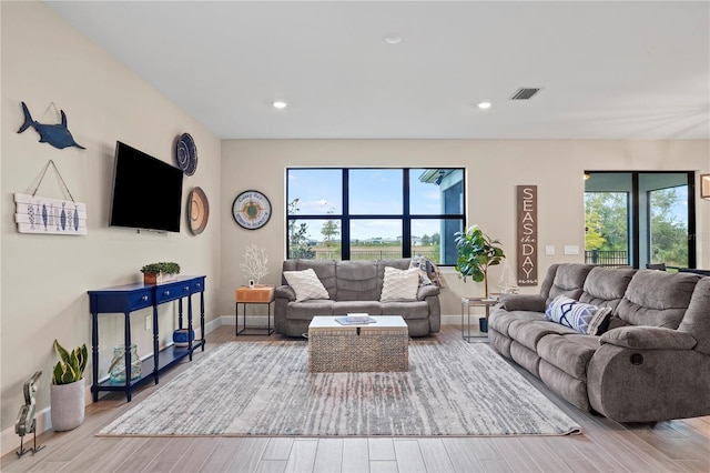 6288 Winding Pine Dr, Nokomis, FL 34275 - living room with plenty of natural light, wood finished floors, baseboards, and recessed lighting