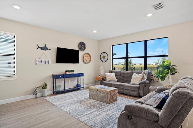 6288 Winding Pine Dr, Nokomis, FL 34275 - living area featuring baseboards, light wood-type flooring, and recessed lighting