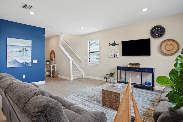 6288 Winding Pine Dr, Nokomis, FL 34275 - living room with stairs, baseboards, wood finished floors, and recessed lighting
