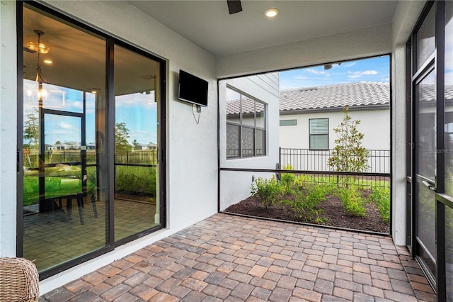 6288 Winding Pine Dr, Nokomis, FL 34275 - unfurnished sunroom featuring ceiling fan