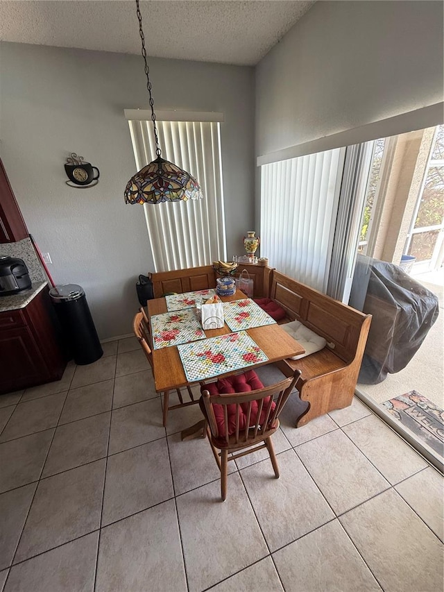 939 Jaybee Ave, Davenport, FL 33897 - dining space featuring tile patterned floors and a textured ceiling