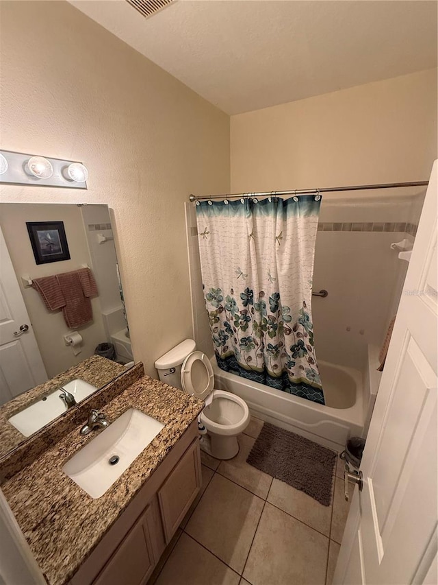 939 Jaybee Ave, Davenport, FL 33897 - bathroom featuring shower / bathtub combination with curtain, vanity, toilet, and tile patterned flooring