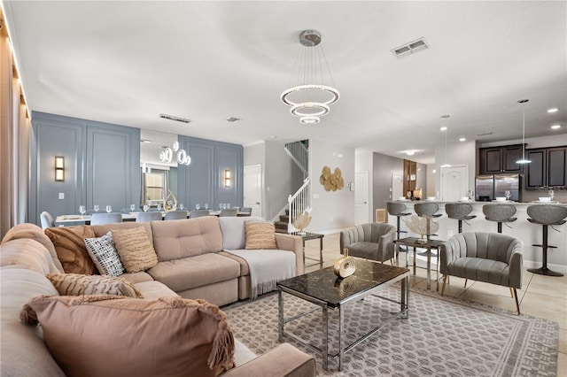 1456 Belle Terre Rd, Davenport, FL 33896 - living room with a chandelier, light tile patterned flooring, stairway, baseboards, and a decorative wall