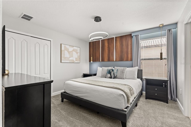 1456 Belle Terre Rd, Davenport, FL 33896 - bedroom with light carpet, baseboards, and a closet