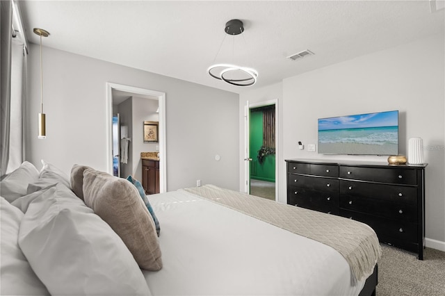 1456 Belle Terre Rd, Davenport, FL 33896 - carpeted bedroom featuring connected bathroom and baseboards