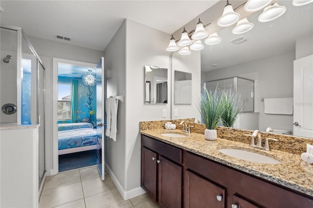 1456 Belle Terre Rd, Davenport, FL 33896 - bathroom with a stall shower, double vanity, ensuite bath, tile patterned floors, and baseboards