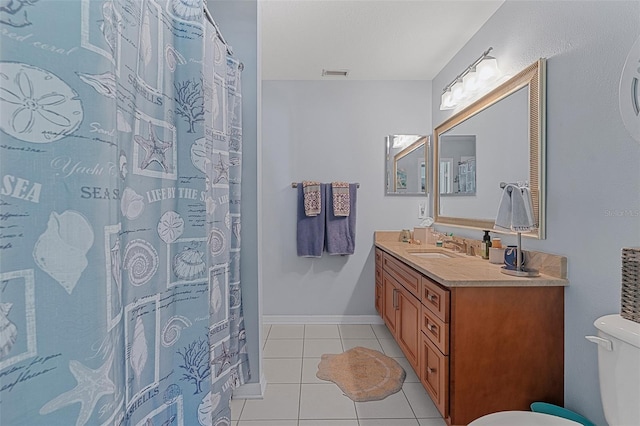 1523 Stafford Ave, Merritt Island, FL 32952 - full bath with toilet, vanity, tile patterned floors, and a shower with shower curtain