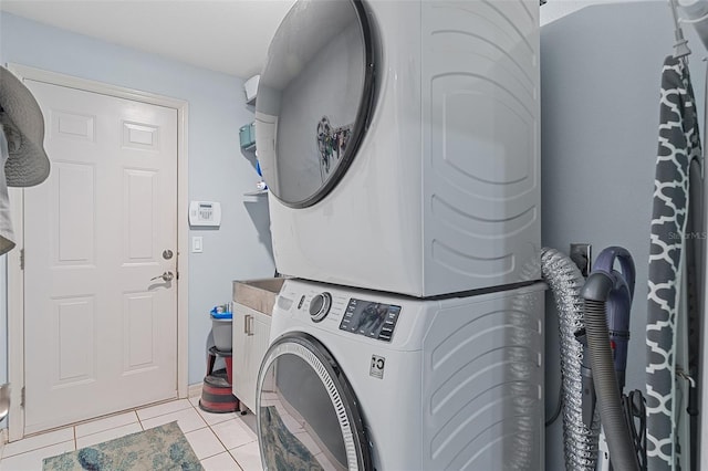 1523 Stafford Ave, Merritt Island, FL 32952 - laundry area featuring stacked washer and clothes dryer and light tile patterned floors