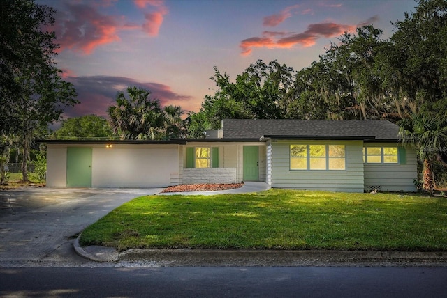 304 W 24th St, Sanford, FL 32771 - view of front of property featuring driveway and a front lawn