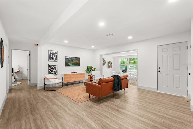 304 W 24th St, Sanford, FL 32771 - living room featuring light wood-style floors, baseboards, and recessed lighting