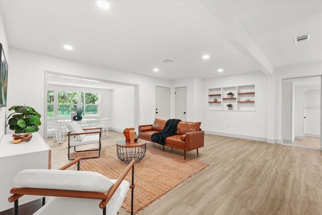 304 W 24th St, Sanford, FL 32771 - living room with light wood-type flooring, recessed lighting, baseboards, and beamed ceiling