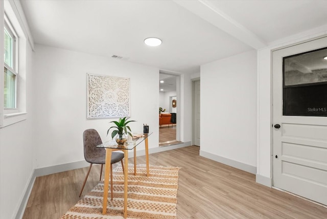304 W 24th St, Sanford, FL 32771 - sitting room with light wood-type flooring and baseboards