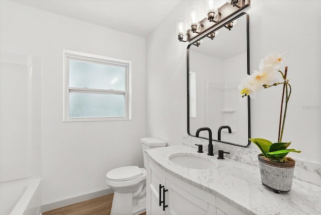 304 W 24th St, Sanford, FL 32771 - bathroom with vanity, toilet, and baseboards