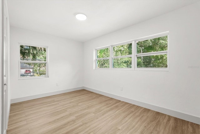 304 W 24th St, Sanford, FL 32771 - unfurnished room with light wood-style floors and baseboards