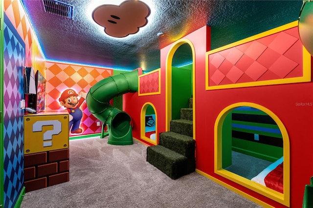 1560 Maidstone Ct, Davenport, FL 33896 - playroom featuring carpet flooring and a textured ceiling