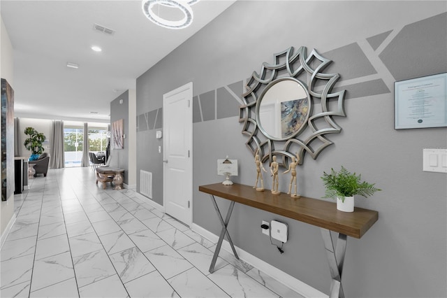 1560 Maidstone Ct, Davenport, FL 33896 - hallway featuring light marble finish flooring and baseboards