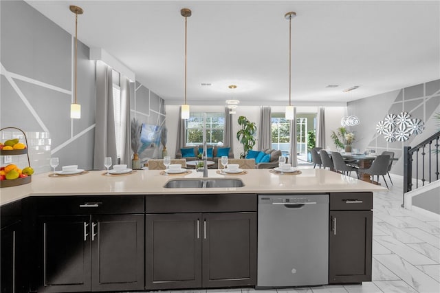 1560 Maidstone Ct, Davenport, FL 33896 - kitchen with stainless steel dishwasher, a sink, light countertops, and open floor plan