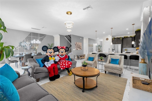 1560 Maidstone Ct, Davenport, FL 33896 - living area with a chandelier and stairs