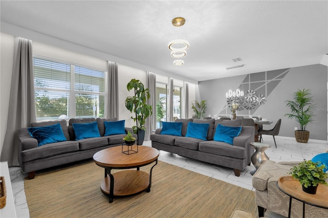 1560 Maidstone Ct, Davenport, FL 33896 - living room with a chandelier and light tile patterned floors