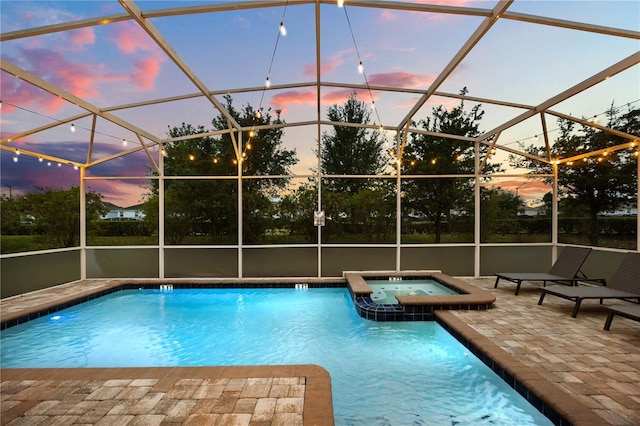 1560 Maidstone Ct, Davenport, FL 33896 - view of swimming pool with a patio, a pool with connected hot tub, and glass enclosure