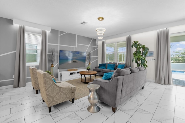 1560 Maidstone Ct, Davenport, FL 33896 - living area with light marble finish flooring and baseboards