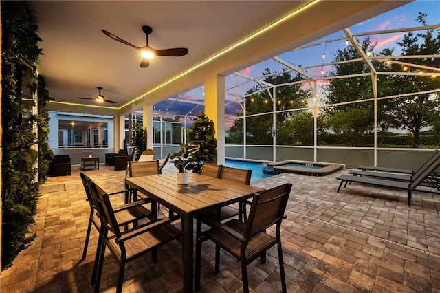 1560 Maidstone Ct, Davenport, FL 33896 - patio terrace at dusk with a patio, ceiling fan, a lanai, and outdoor dining area