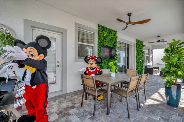 1560 Maidstone Ct, Davenport, FL 33896 - view of patio featuring ceiling fan and outdoor dining space