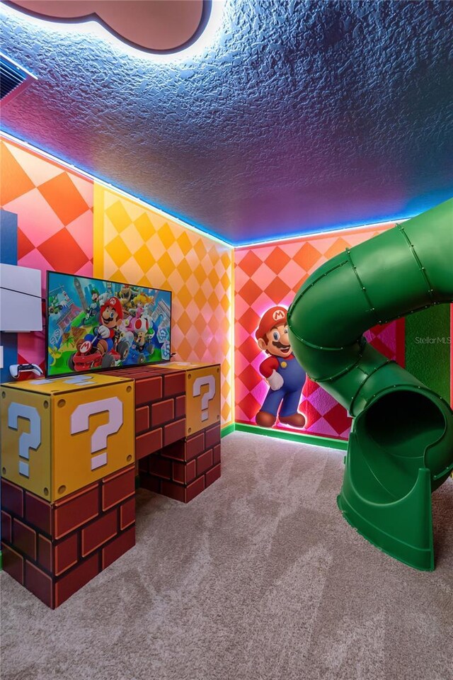 1560 Maidstone Ct, Davenport, FL 33896 - playroom with carpet floors, a textured ceiling, and wallpapered walls