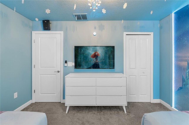 1560 Maidstone Ct, Davenport, FL 33896 - bedroom with carpet, a closet, baseboards, and a textured ceiling