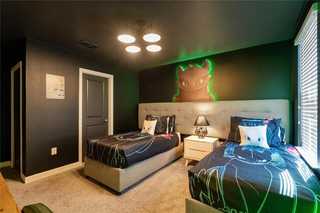 1560 Maidstone Ct, Davenport, FL 33896 - bedroom featuring carpet flooring, a textured wall, and baseboards