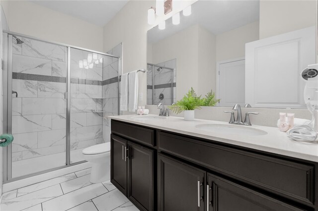 1560 Maidstone Ct, Davenport, FL 33896 - full bathroom with marble finish floors, double vanity, a stall shower, and toilet