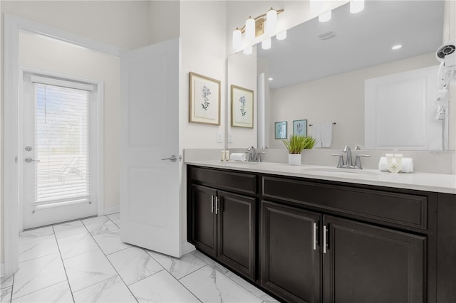 1560 Maidstone Ct, Davenport, FL 33896 - full bathroom featuring double vanity and marble look tiles