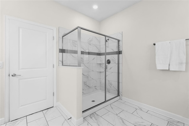 1560 Maidstone Ct, Davenport, FL 33896 - full bathroom featuring marble finish flooring, a marble finish shower, and baseboards