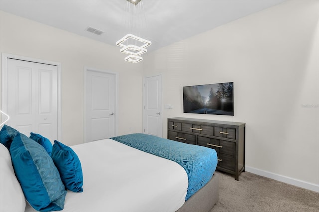 1560 Maidstone Ct, Davenport, FL 33896 - bedroom with light colored carpet, baseboards, a chandelier, and a closet