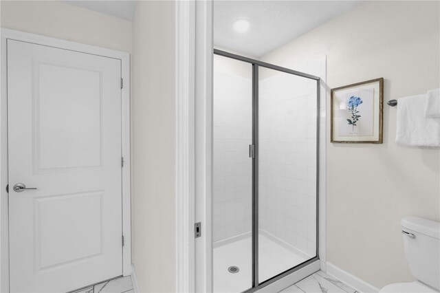 1560 Maidstone Ct, Davenport, FL 33896 - full bathroom with marble finish floors, baseboards, a shower stall, and toilet