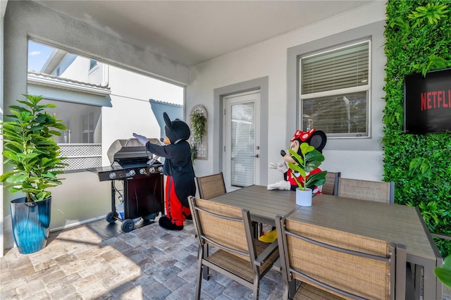1560 Maidstone Ct, Davenport, FL 33896 - view of patio / terrace with outdoor dining area and grilling area