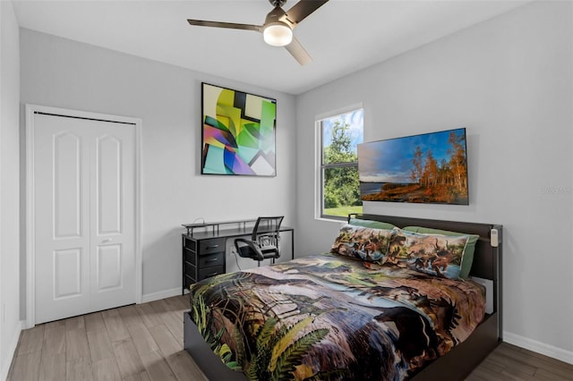 1504 Cordgrass Way, Lakeland, FL 33813 - bedroom featuring wood finished floors, baseboards, and ceiling fan