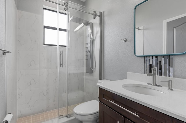 1504 Cordgrass Way, Lakeland, FL 33813 - full bath featuring a marble finish shower, vanity, toilet, and a textured wall