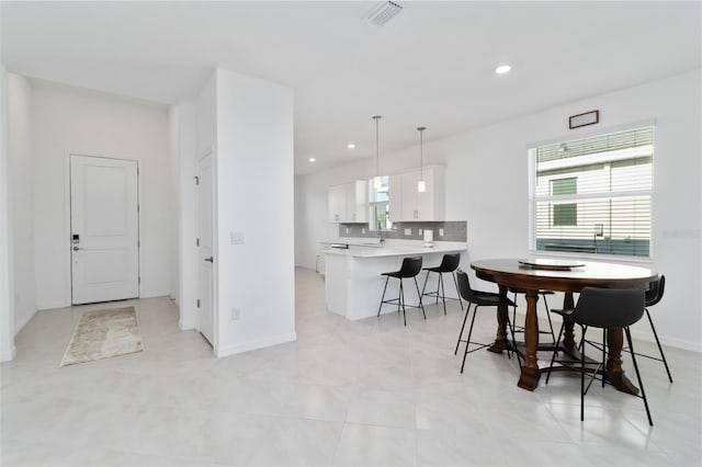 11330 Burgundy Dr, Venice, FL 34293 - dining space featuring recessed lighting, baseboards, and light tile patterned floors