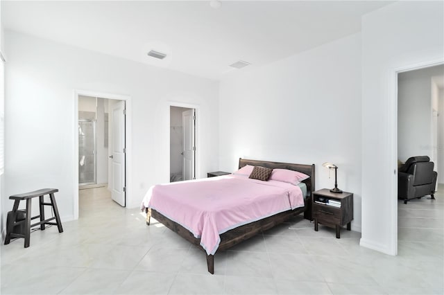 11330 Burgundy Dr, Venice, FL 34293 - bedroom featuring arched walkways and light tile patterned floors