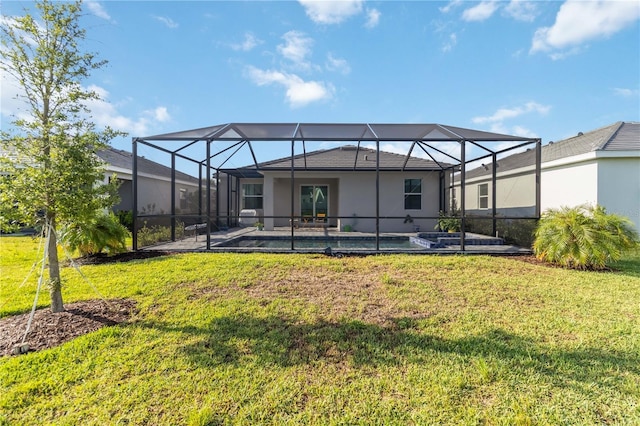 11330 Burgundy Dr, Venice, FL 34293 - back of property featuring a patio area, a yard, a pool with connected hot tub, and stucco siding