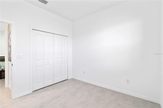 11330 Burgundy Dr, Venice, FL 34293 - unfurnished bedroom featuring baseboards and a closet