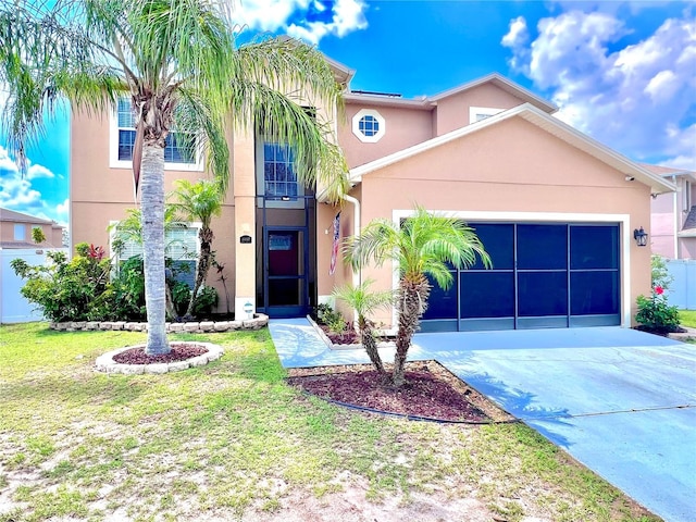4447 Maple Chase Trl, Kissimmee, FL 34758 - view of front of property with a garage, driveway, stucco siding, and a front yard
