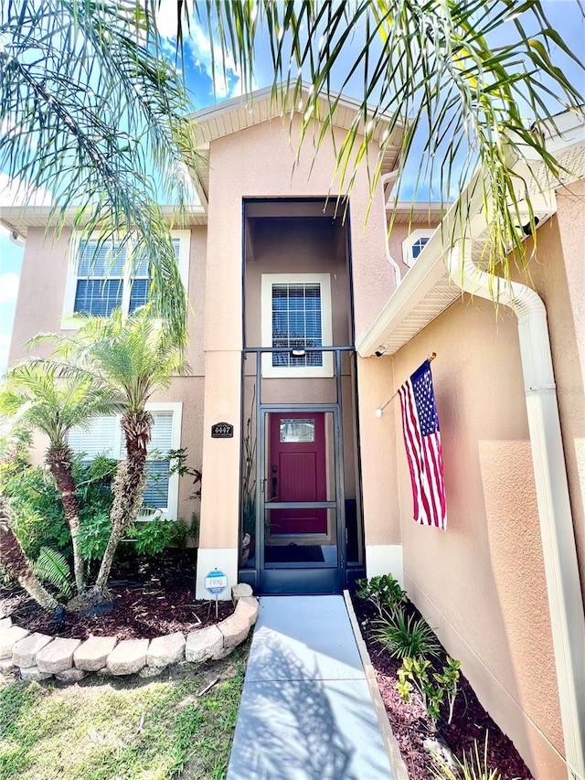 4447 Maple Chase Trl, Kissimmee, FL 34758 - property entrance with stucco siding