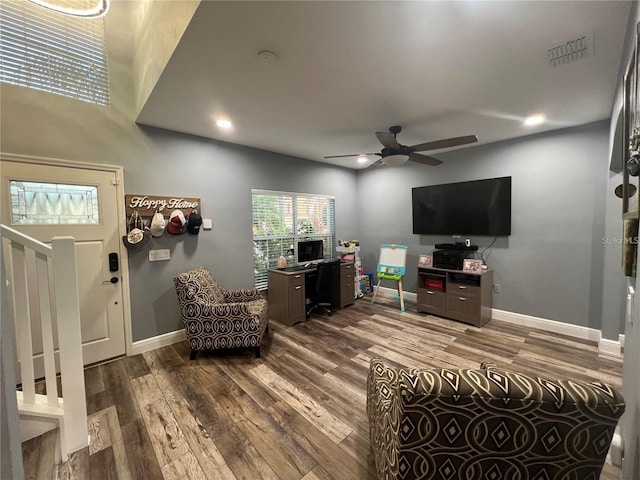 4447 Maple Chase Trl, Kissimmee, FL 34758 - living room with wood finished floors, baseboards, ceiling fan, stairs, and recessed lighting