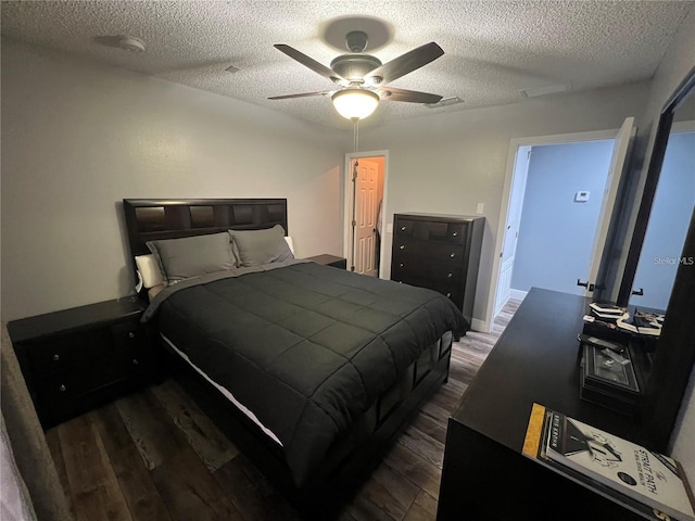 4447 Maple Chase Trl, Kissimmee, FL 34758 - bedroom with dark wood finished floors, a textured ceiling, and ceiling fan