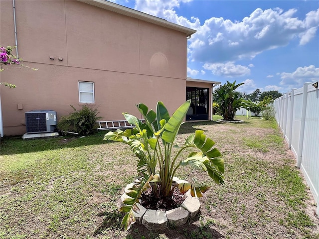 4447 Maple Chase Trl, Kissimmee, FL 34758 - view of yard with cooling unit and a sunroom