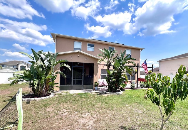 4447 Maple Chase Trl, Kissimmee, FL 34758 - back of house with a sunroom, stucco siding, and a yard